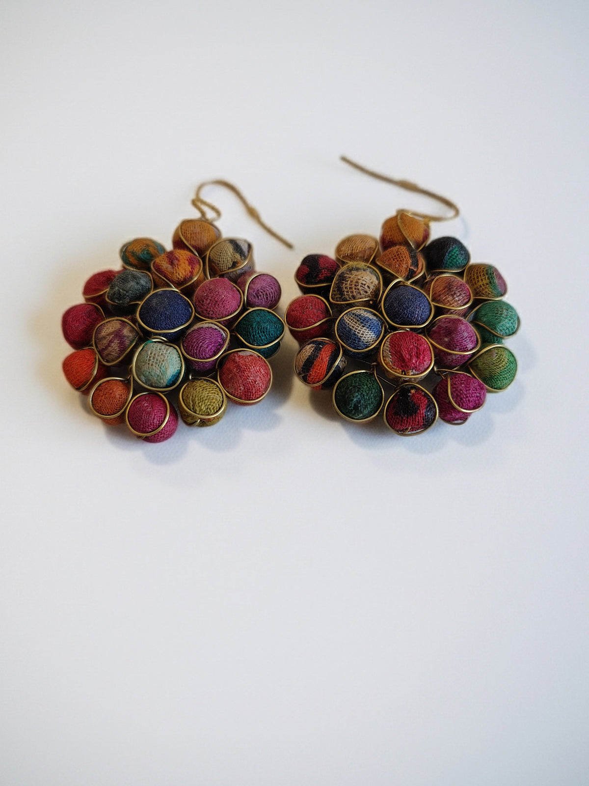 Multicolored beaded earrings on a white background