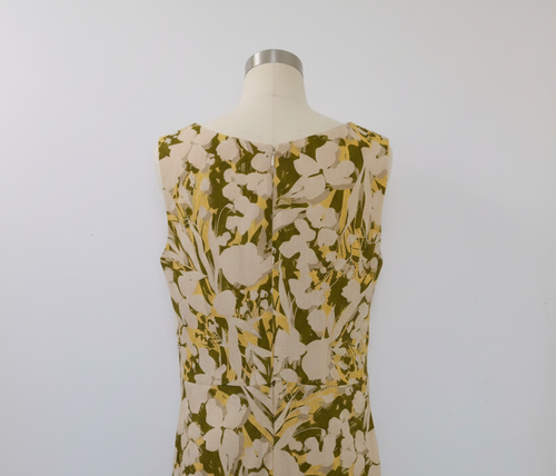 Floral jacquard dress - back view showing V-neckline detail on a mannequin 